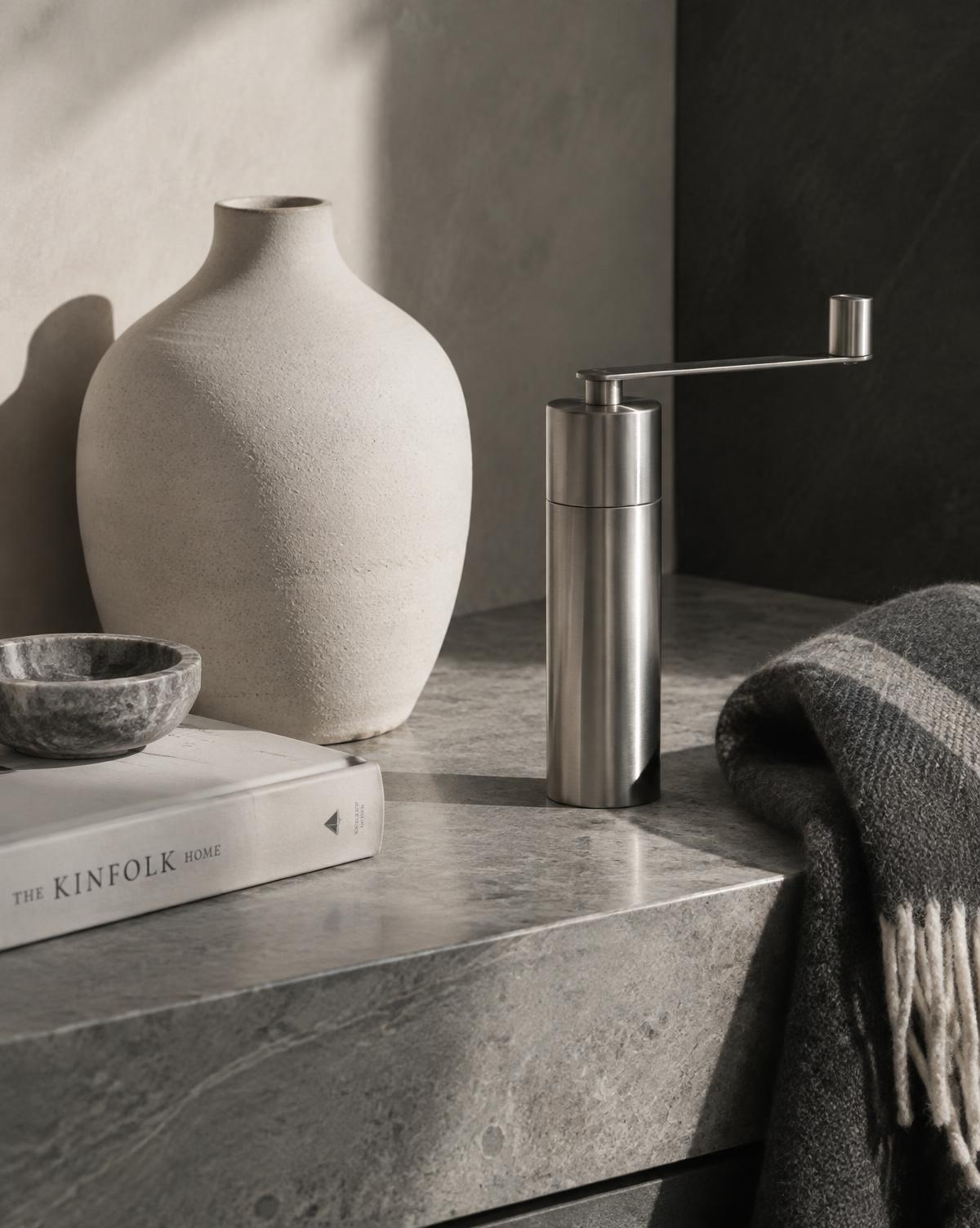 Scandinavian design objects on a stone surface